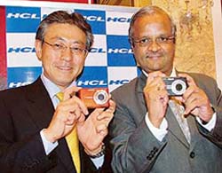 Mr T.Kyoden, Managing Director, Casio India, and Mr J.V. Ramamurthy, Chief Operating Officer, HCL Infosystems Ltd, display a 10-mega pixel camera in New Delhi