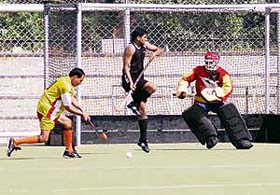 The match between the Madhya Pradesh circle and the Uttar Pradesh circle in progress at the 20th All-India Postal Hockey Tournament at the Prithipal Singh Memorial Astro Turf Stadium in Ludhiana