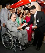 Indian publisher Ashwani Goyal presents books to Human Resource Development Minister Arjun Singh during the opening ceremony of the Indian stand at the International Book Fair in Frankfurt, central Germany, on Wednesday