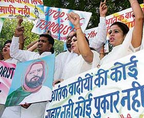 Activists of the Muslim Yuva Ekta Committee raise slogans against Mohammad Afzal during a protest in New Delhi