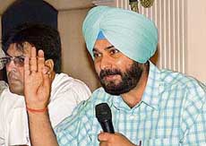 BJP MP Navjot Singh Sidhu addresses a press conference in Jalandhar on Thursday. 