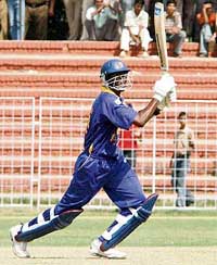 Sri Lankas Ferveez Maharoof hits a six off the bowling of Amit Uniyal of PCA Presidents XI during a warm-up match at the Sector 16 Cricket Stadium in Chandigarh on Thursday