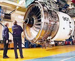 Rolls-Royce employees inspect a Trent 900 jet engine in this undated