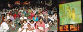 People enjoy a show of Ramayan on the big screen installed by the Market Association of Sector 31-D, Chandigarh. 