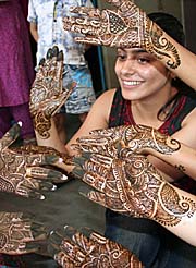 Young girls show off their mehndi-decorated hands on the eve of Karva Chauth in Amritsar.