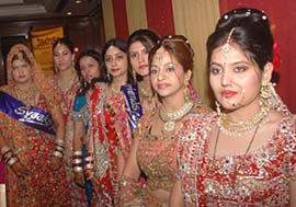 City women compete for a modelling show held on the occasion of Karva Chauth in Jalandhar on Tuesday.