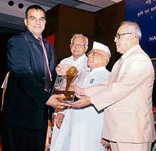 Ludhiana-based Safari Bikes’ executive director Suresh Sharma receives the national award for quality from Defence Minister Pranab Mukherjee in New Delhi.