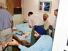CBI officials inspect documents at Arvind Khannas Sector 39 official residence in Chandigarh on Tuesday.
