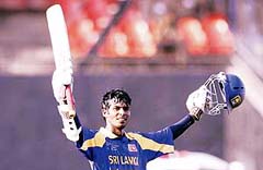 Sri Lankas Upal Tharanga celebrates his century against Zimbabwe during a Champions Trophy qualifying match at the Sardar Patel Stadium in Ahmedabad