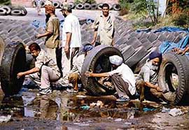 The CTU staff clean tyres at the scrapyards of the depots on Wednesday.