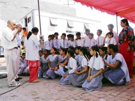 The eyesight of students is examined at a medical camp in the Jamalpur locality of Ludhiana