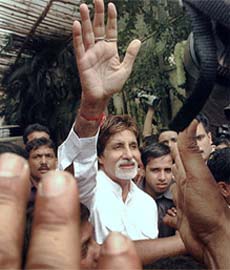 Superstar Amitabh Bachchan waves to his fans on his 65th birthday at his residence in Mumbai