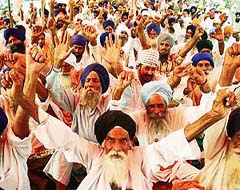 Farmers protest against a land acquisition notification for setting up a special economic zone during a rally in Amritsar 