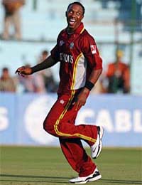 Dwayne Bravo of the West Indies celebrates after dismissing Bangladeshs Mashrafe Mortaza during their qualifying match for the ICC Champions Trophy in Jaipur