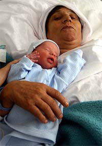 Sixtyfour-year-old Turkish woman Memmune Tiryaki lies with her baby at a hospital in Istanbul on Wednesday. The 64-year-old has given birth to a baby boy in Istanbul, becoming the second oldest mother in the world.
