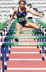 Silva Lucimara Silvestre of Brazil competes in the womens 110m hurdles at the 1st Lusofonia Games in Macau