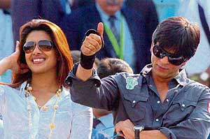 Shah Rukh Khan and Priyanka Chopra watch the Champions Trophy match between India and England at the Sawai Man Singh Stadium in Jaipur on Sunday.