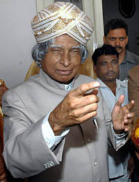 President A.P.J. Abdul Kalam wears a traditional Mysore Peta (headgear) presented to him on his 75th birthday, at Raj Bhavan in Bangalore on Sunday.