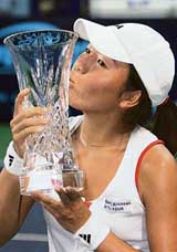 Vania King of the USA kisses the trophy after beating Thailands Tamarine Tanasugarn 2-6, 6-4, 6-4 in the final of the Bangkok Open womens tennis tournament on Sunday