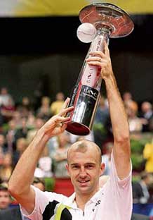Ivan Ljubicic of Croatia lifts the trophy after beating Chiles Fernando Gonzalez in the final of the Vienna Open on Sunday. Ljubicic won 6-3, 6-4, 7-5.