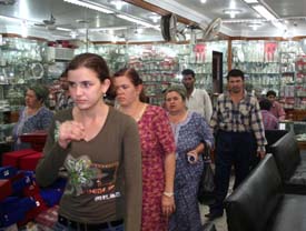 Foreign tourists buy silver products in Guru Bazaar, Amritsar