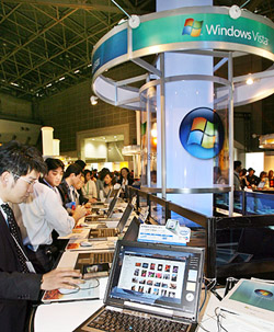 Customers browse Microsoft's new operating system "Windows Vista" with some 200 PCs at the WPC computer trade show in Tokyo
