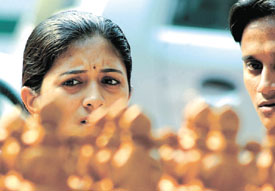A girl and a boy having a look at the idols of Goddess Lakshmi on Dhanteras on Thursday.