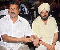 Hardeep Singh Dhillon (left), secretary, Punjab Hockey Association, with international umpire Kuku Walia at the briefing of the technical staff at the PAP Complex, Jalandhar, on Thursday. 