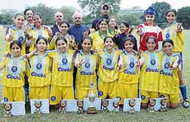 The women football team of St. Stephens, Sector 45, after winning the 8th Deepak Kapania Memorial Women Football Tournament at Sector 17 in Chandigarh on Saturday