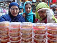 Women out for shopping on the occasion of Id-ul-Fitr in Srinagar on Sunday.
