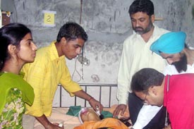 Doctors examine Arshpreet Kaur in a hospital at Ahmedgarh on Sunday