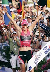 Australias Michellie Jones celebrates after winning the marathon during the womens Ironman World Championship triathlon in Kona, Hawaii,