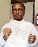 Mr Vadish Kumar Gupta shows a letter 