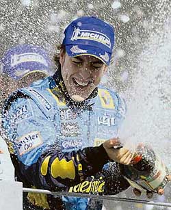 Renaults Fernando Alonso of Spain sprays champagne after winning the Formula One title in Sao Paulo, Brazil, on Sunday. 