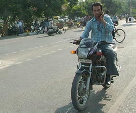 A youth rides his bike and talks on the cellphone oblivious to his own safety as well as of others in Jalandhar on Tuesday.