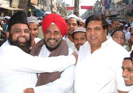 Mr Atiq-ur-Rehman, president of the minority cell of the Punjab Pradesh Congress Committee, greets the PPCC president, Mr Shamsher Singh Dullo, during the Id celebrations in Ludhiana on Tuesday