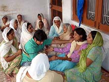 The widow and mother of slain DIG Jaswinder Singh along with other family members mourn at their house in Bodal village on Tuesday.