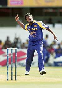 Sri Lankas Lasith Malinga celebrates after dismissing South Africas Herschelle Gibbs during their Champions Trophy match in Ahmedabad