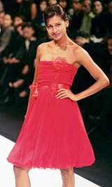 A model presents a creation by Spanish designer Tony Francesc at the Fashion Week in Mexico City