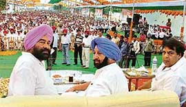 The Chief Minister, Capt Amarinder Singh, flanked by the Ludhiana Mayor, Mr Nahar Singh Gill (left), and the Parliamentary Secretary, Mr Surinder Dawer (right), during a public function at Sherpur in Ludhiana on Wednesday.
