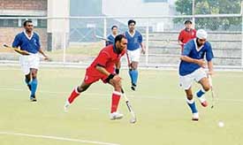 Services and Bengal in progress during the 62nd National Hockey Championship at PAU in Ludhiana on Wednesday. 