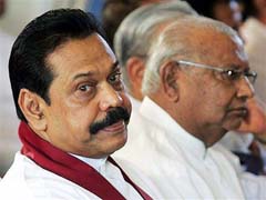 Sri Lankas President Mahinda Rajapakse (left) and Prime Minister Rathnasiri Wickremanayeka attend a ceremony of a signing of a pact envisaging a joint approach to a stalled peace process with the main Opposition parties in Colombo