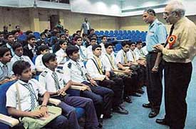 Chairman of Aeronautical Society of Indias Chandigarh chapter, Air Cmde R.K. Srivastava, interacts with students participating in the National Space Olympiad in Chandigarh on Thursday. 