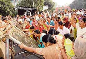 Anganwadi workers and helpers from Punjab stage a protest at Matka Chowk in Sector 17, Chandigarh, on Thursday.