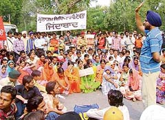 Activists of the ITI Employees Union and ITI students block traffic on the Bathinda-Mansa road in favour of their demands, in Bathinda 