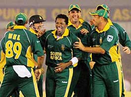 South Africas Makhaya Ntini (centre) is congratulated by his team-mates after taking a Pakistani wicket during their Group B match at the PCA Stadium in Mohali on Friday. 