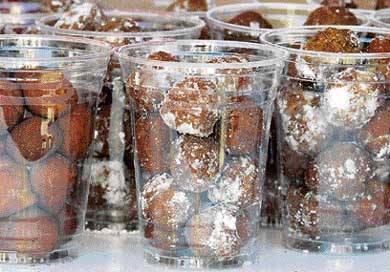 Cups of fried Coke are put on sale in this undated picture. A new fast food is making its debut at the US fairs this fall  fried Coke. Creator Abel Gonzales, 36, a computer analyst from Dallas, Texas, tried about 15 different varieties before coming up with his perfect recipe  a batter mix made with Coca-Cola syrup, a drizzle of strawberry syrup and some strawberries
