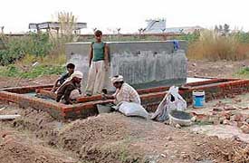 Final touches being given to a water post at new dharna site in Sector 25, Chandigarh