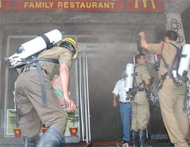 Firefighters at the site of a fire that broke out in a popular eatery located in Janpath in the Capital on Saturday.