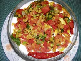 Madrasi tadkewala raita is hung curd tempered with curry leaves, mustard and red chillies